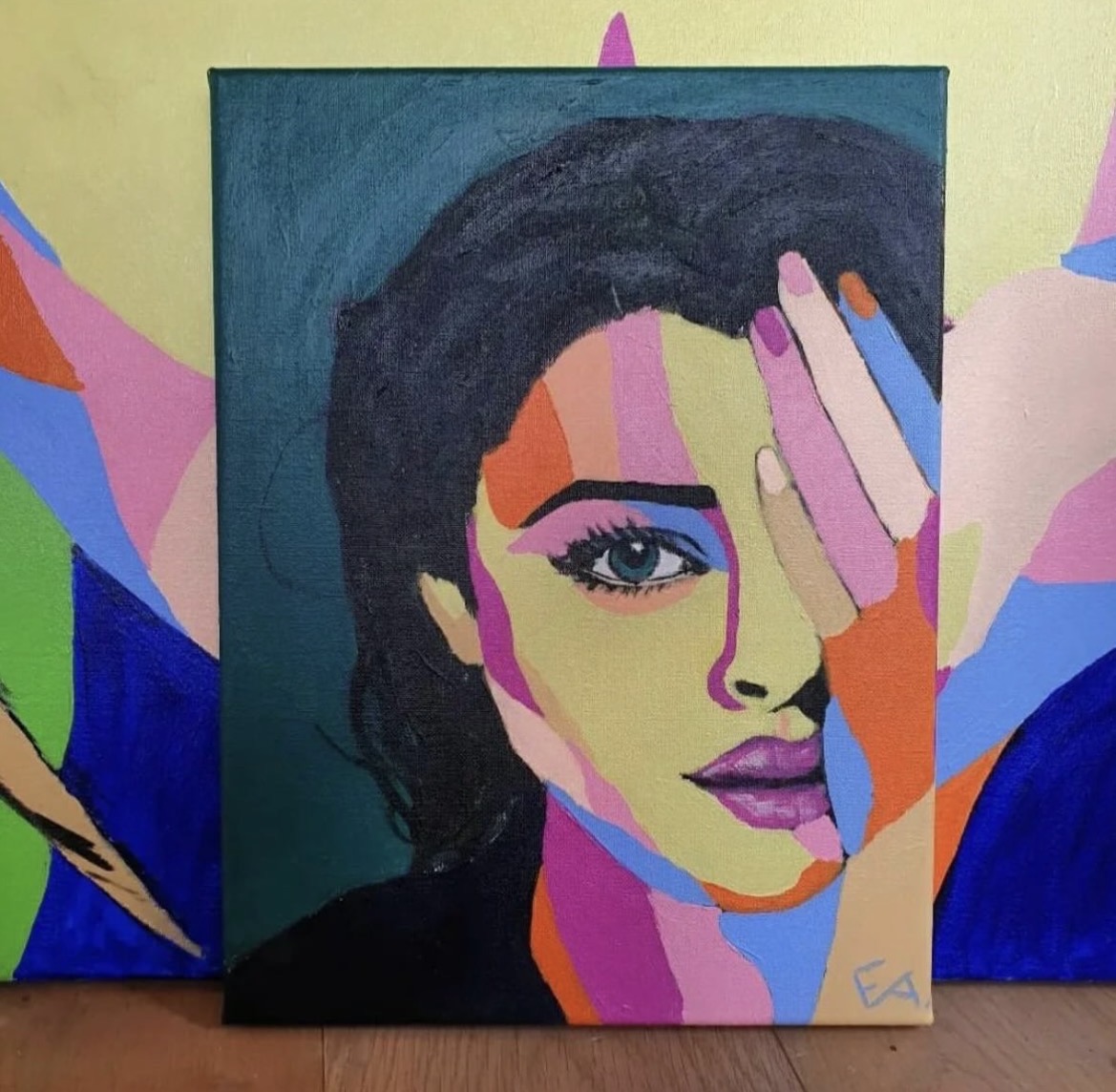 Painted portrait of a dark-haired woman holding her hand over half her face, in pink, orange and blue tones on deep green